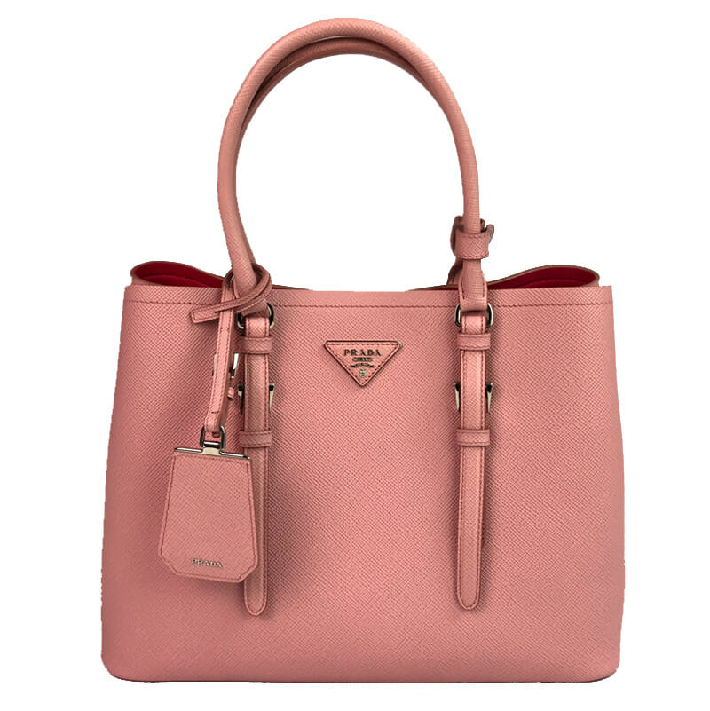 The Prada Double bag in Saffiano Cuir leather comes with a double