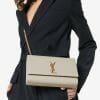 saint laurent ysl kate bag medium in nude powder with gold hardware on model