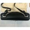 Louis Vuitton lock me bb bag in black top down