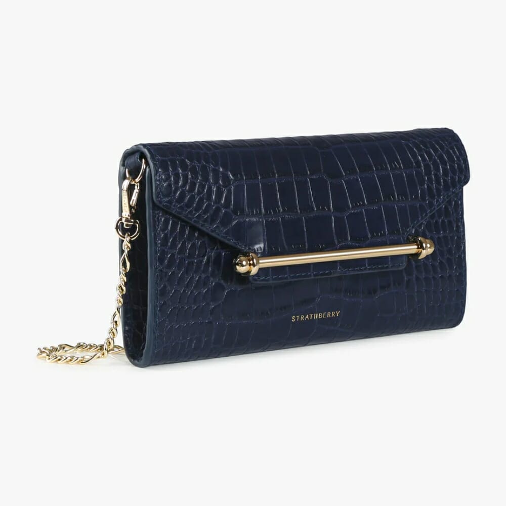kate carrying strathberry in navy (picture of black clutch also owned by  kate)